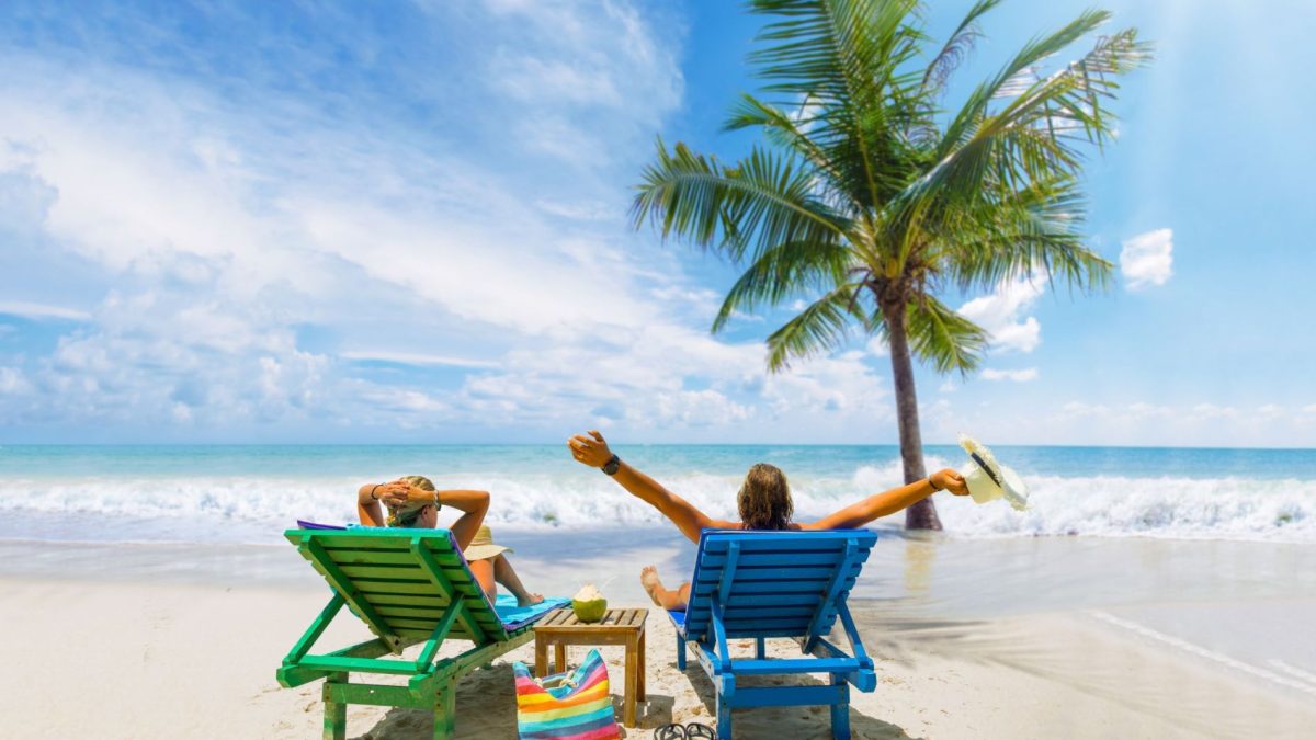 people in chairs on the beach